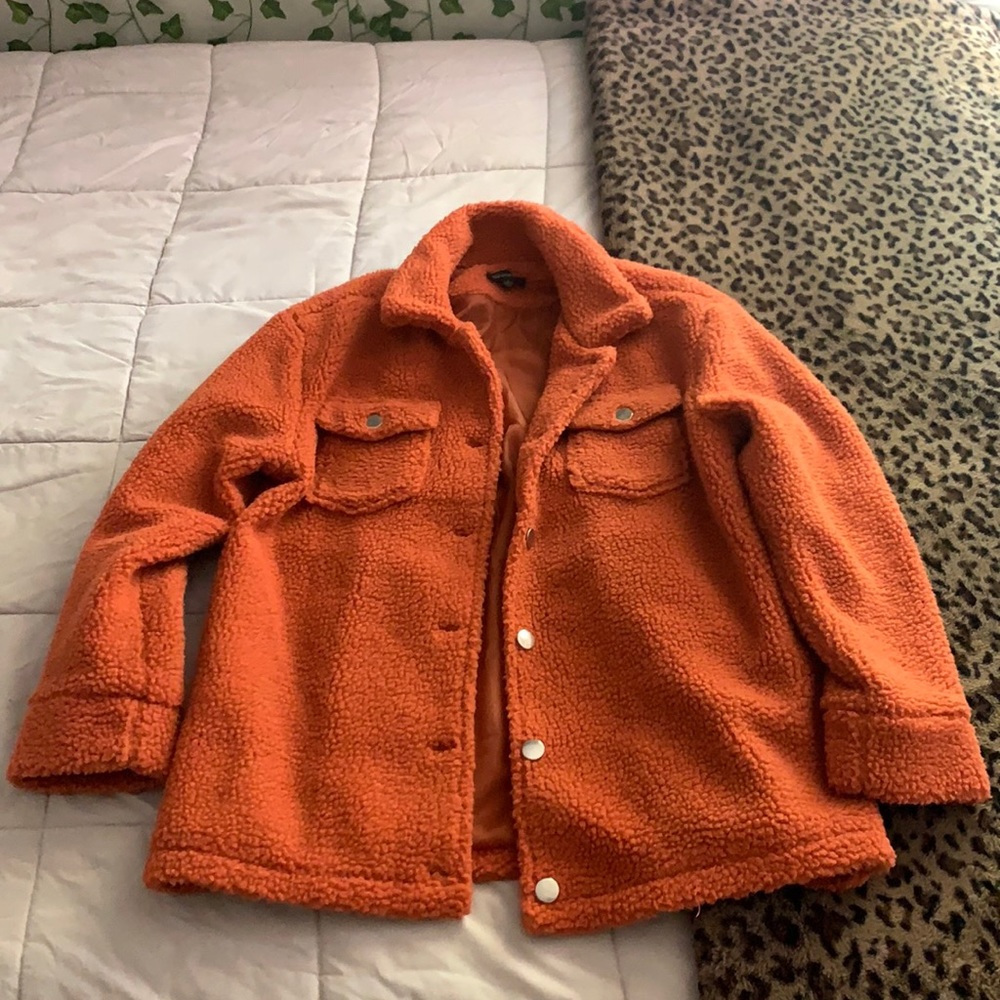 An orange fur coat/jacket